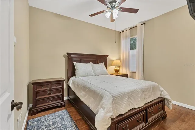 a bathroom with a granite countertop sink toilet and a mirror