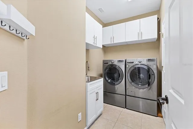 a view of a backyard with table and chairs
