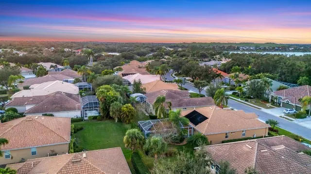 a view of balcony with wooden floor and fence