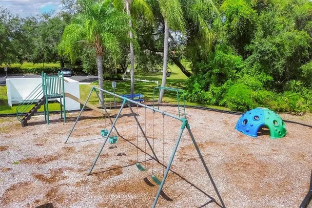 an aerial view of lake residential house with outdoor space and trees