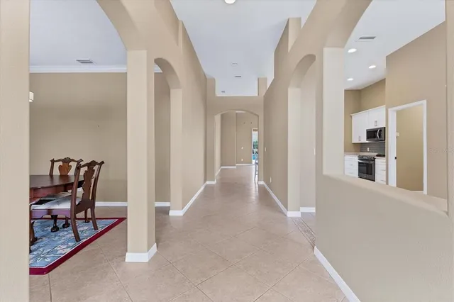 a view of a livingroom with furniture and a ceiling fan