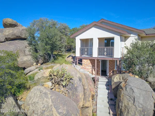 a view of a patio with couches chairs and potted plants