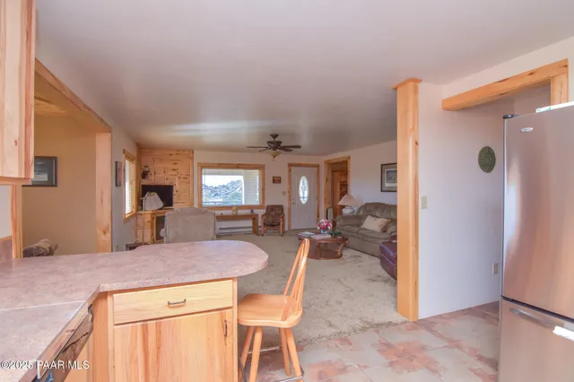 a kitchen with a table and chairs in it