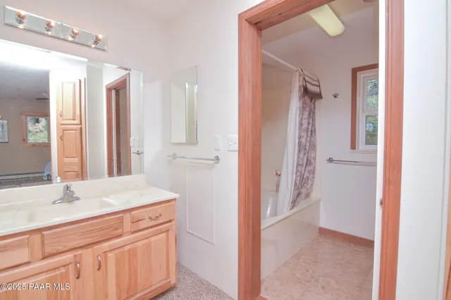 a bathroom with a granite countertop sink mirror and a