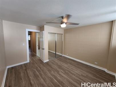 425 Ena Road, Unit B101 Honolulu, HI 96815 - Photo 2 of 6 a view of an empty room with wooden floor