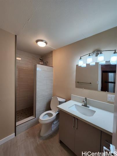 425 Ena Road, Unit B101 Honolulu, HI 96815 - Photo 5 of 6 a bathroom with a sink toilet a mirror and shower