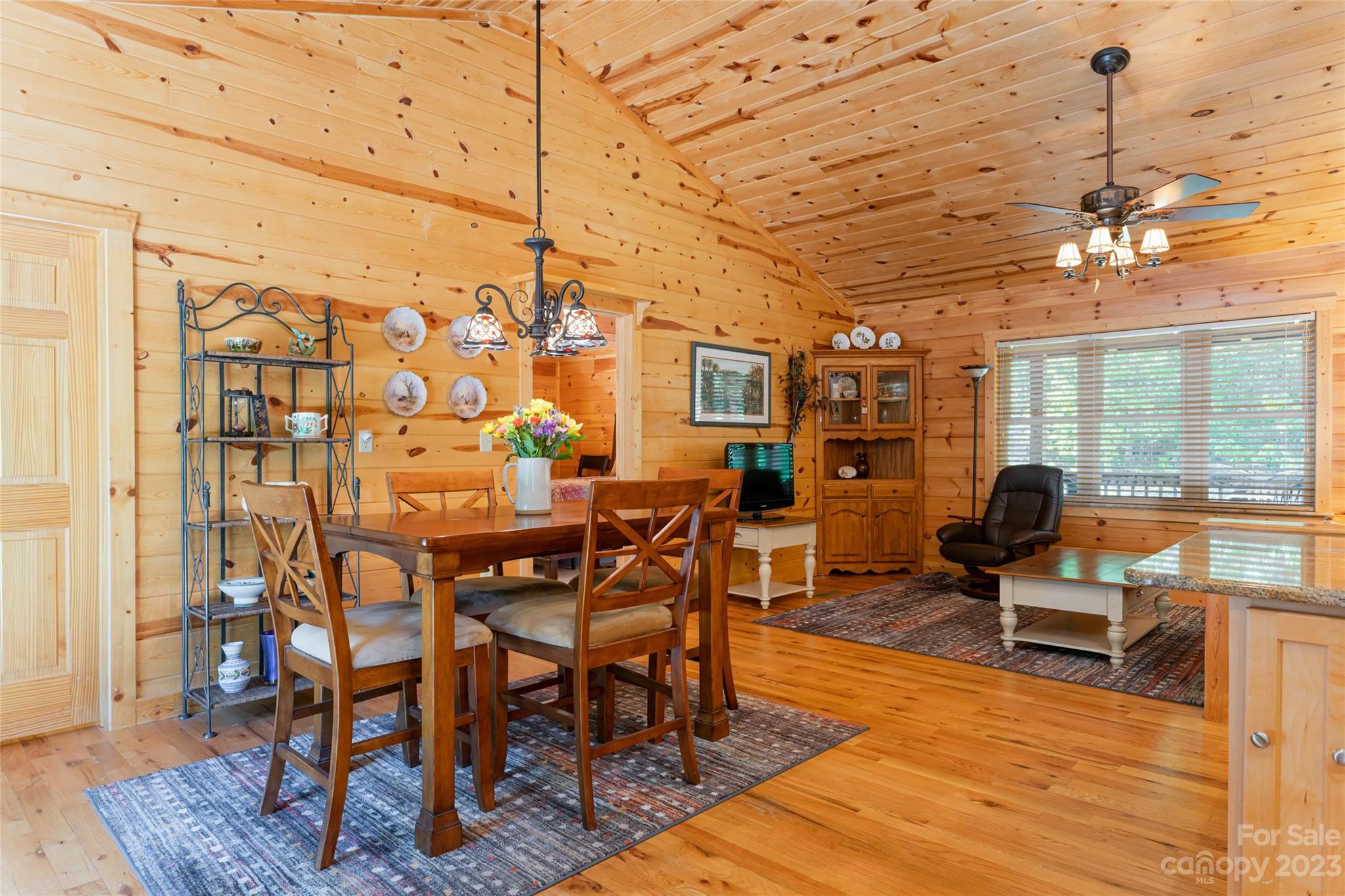 134 Quebec Trail Bostic, NC 28018 - Photo 13 of 37 a view of a dining room with furniture wooden floor and a rug