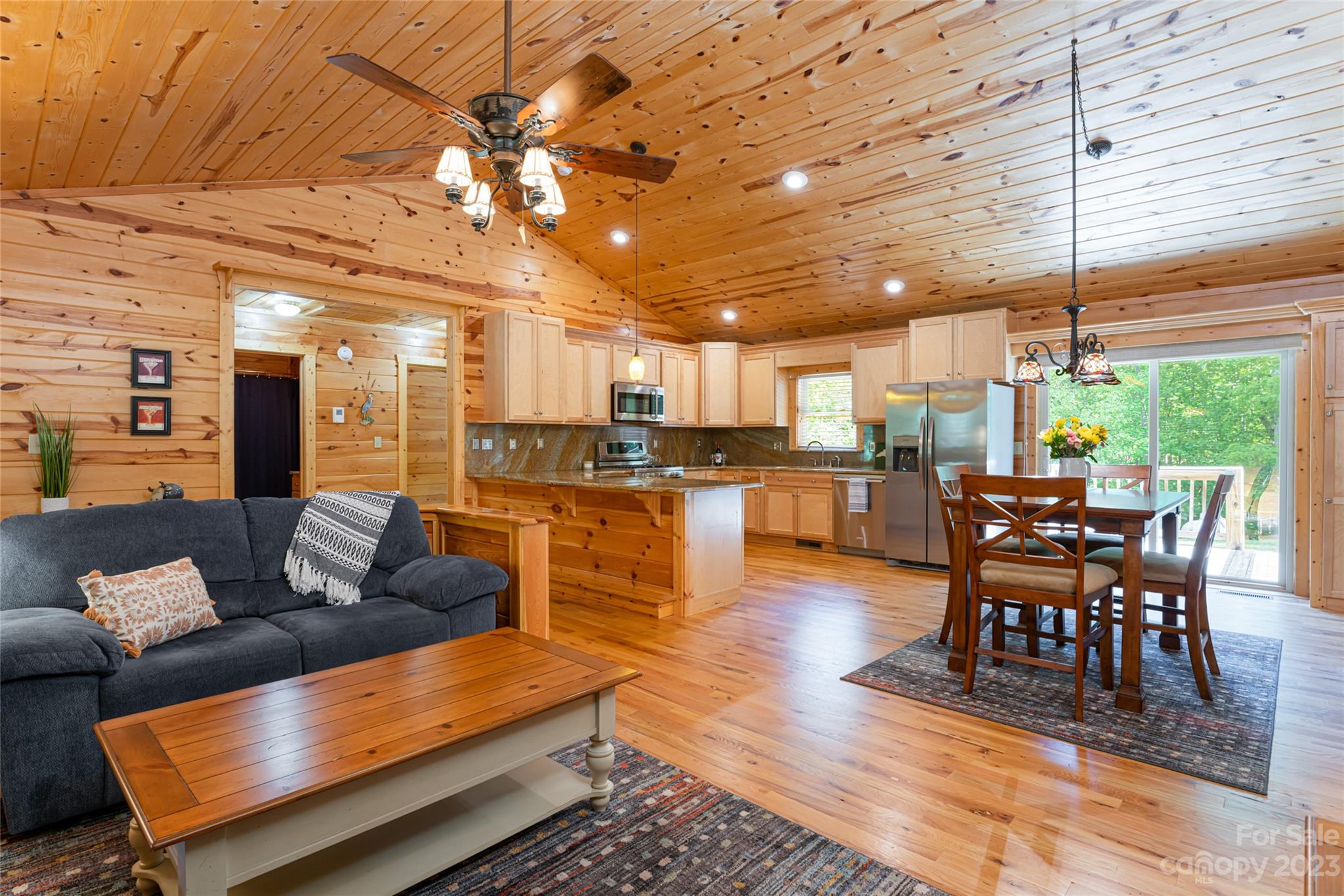 134 Quebec Trail Bostic, NC 28018 - Photo 2 of 37 a living room with furniture and kitchen view