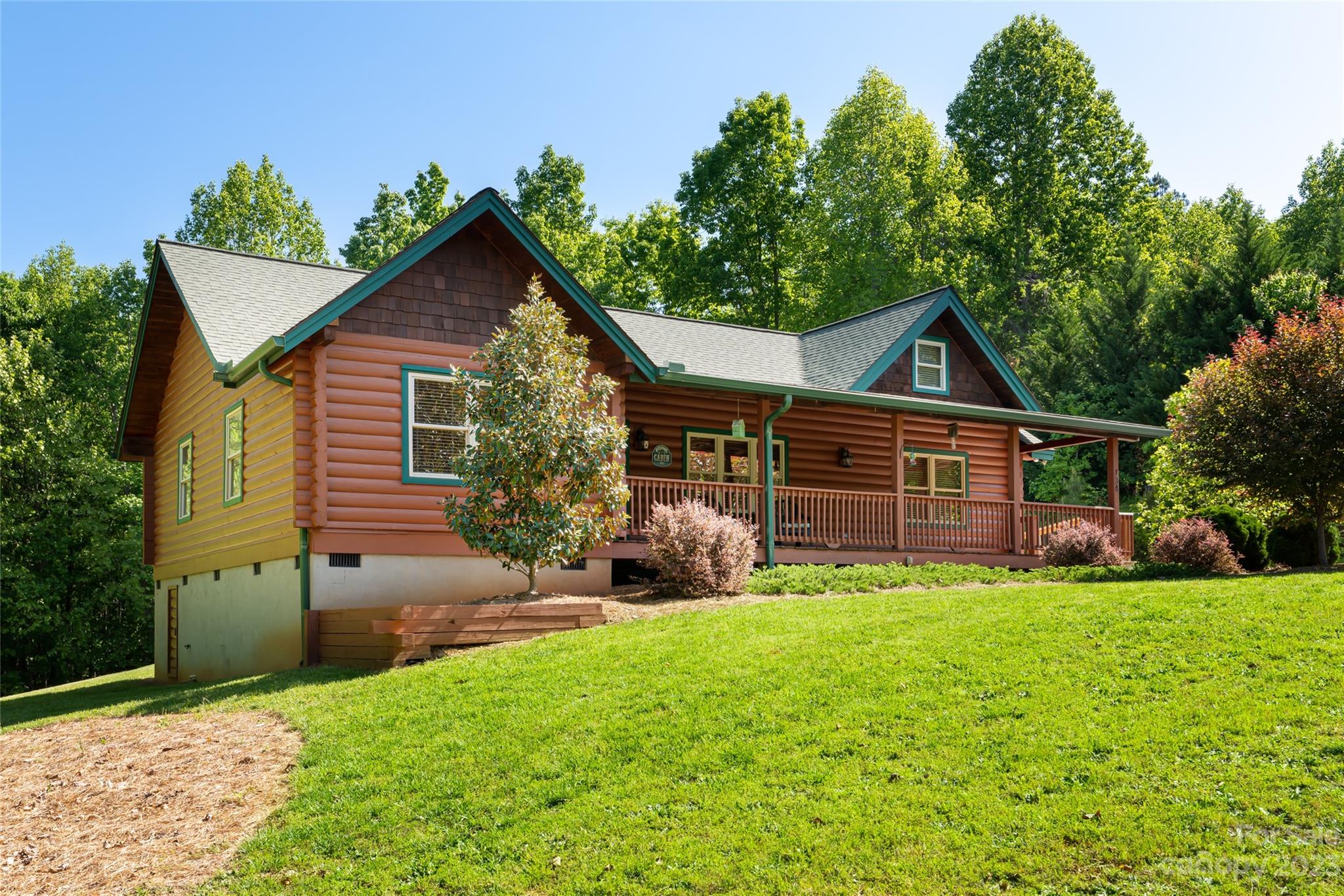 134 Quebec Trail Bostic, NC 28018 - Photo 28 of 37 a view of a house with a yard and sitting area
