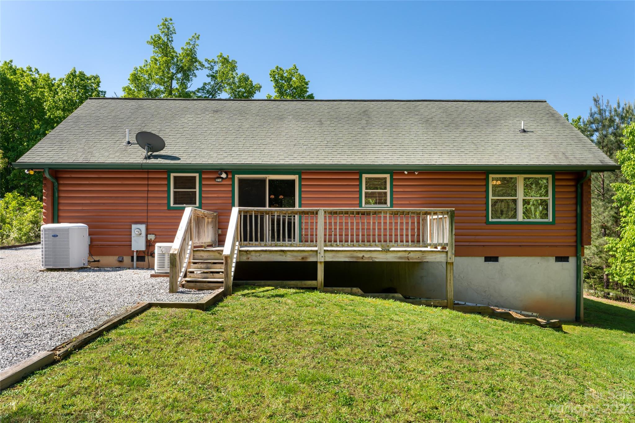 134 Quebec Trail Bostic, NC 28018 - Photo 32 of 37 a backyard of a house with barbeque oven table and chairs