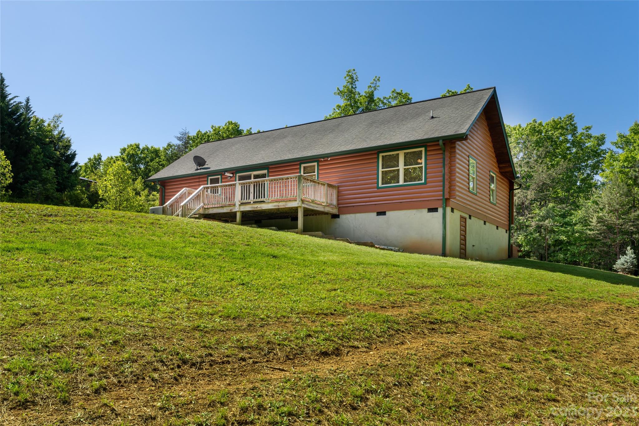 134 Quebec Trail Bostic, NC 28018 - Photo 36 of 37 a house view with a garden space