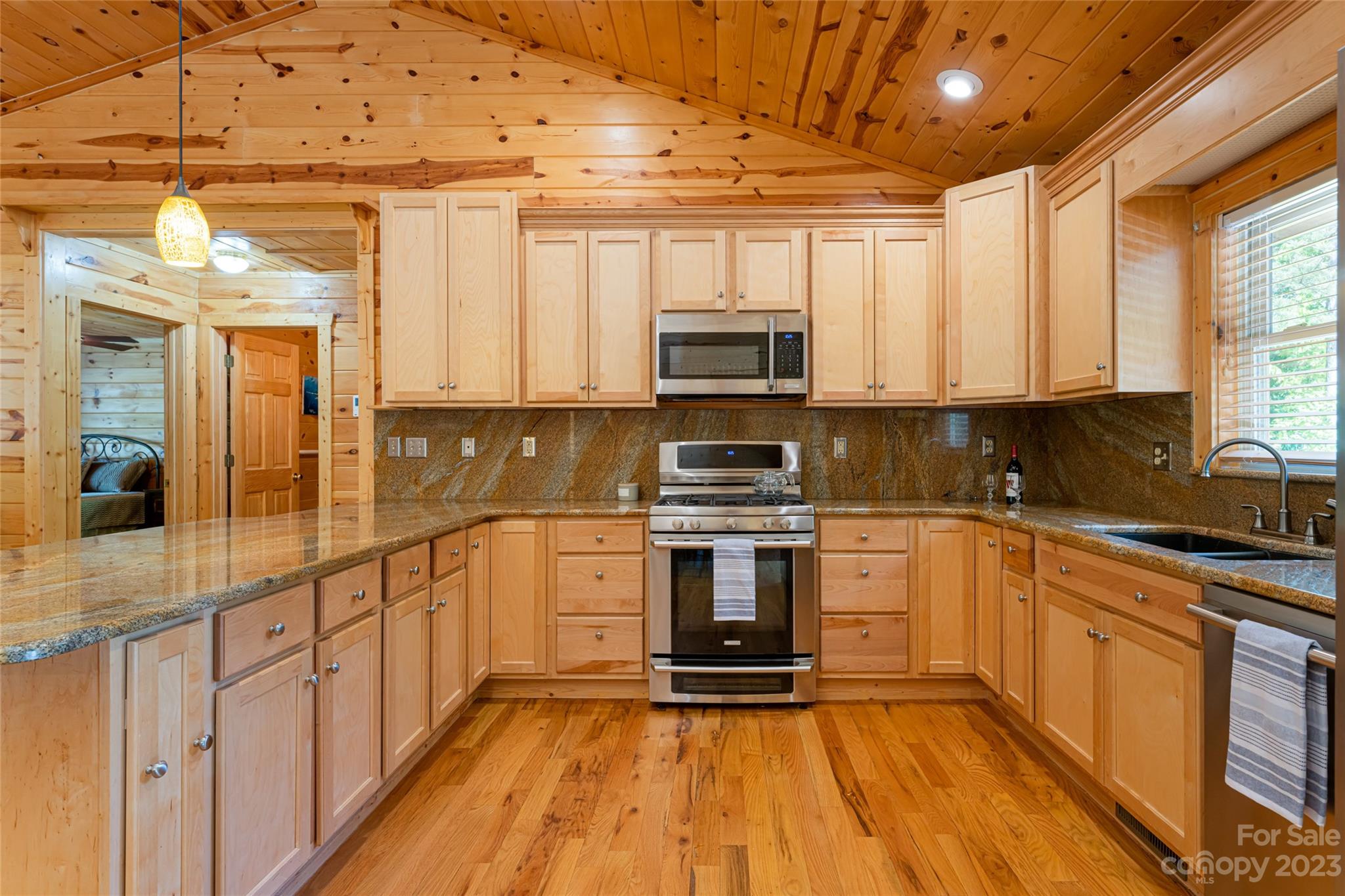 134 Quebec Trail Bostic, NC 28018 - Photo 5 of 37 a kitchen with stainless steel appliances a sink cabinets and wooden floor