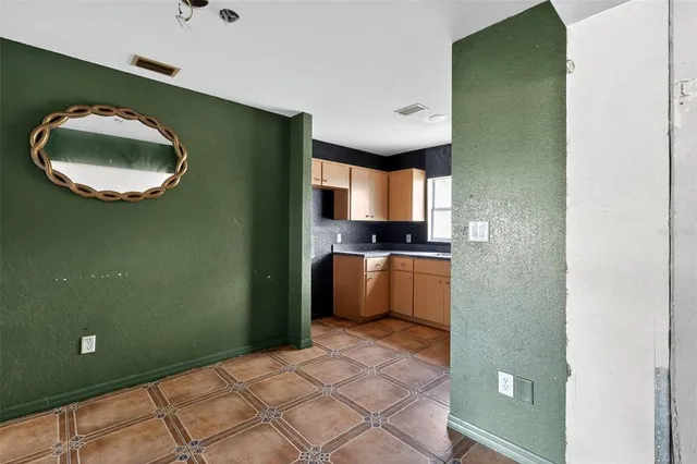 a view of a kitchen with a sink and a stove top oven