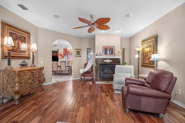 a living room with furniture window and wooden floor