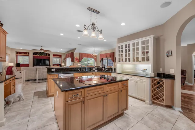 a kitchen with stainless steel appliances granite countertop a sink and cabinets