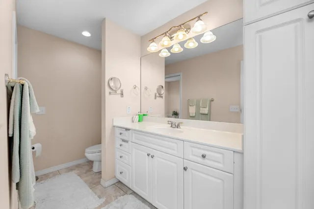 an aerial view of a house with swimming pool and outdoor seating