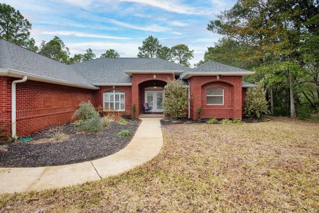 swimming pool view with a garden space