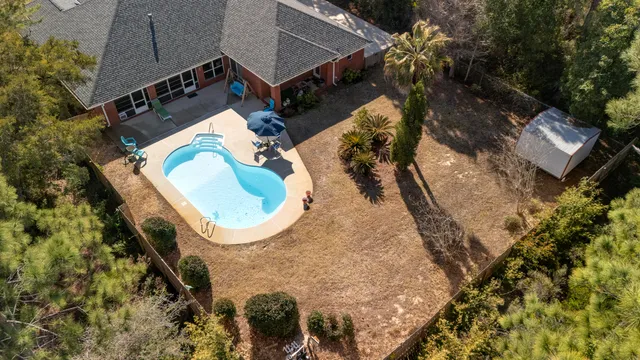 a view of a swimming pool with a patio