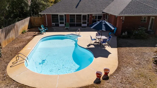 a view of swimming pool and lounge chair