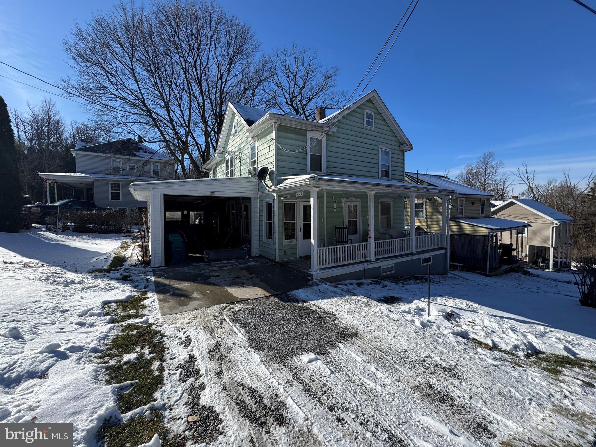 a view of house with a yard