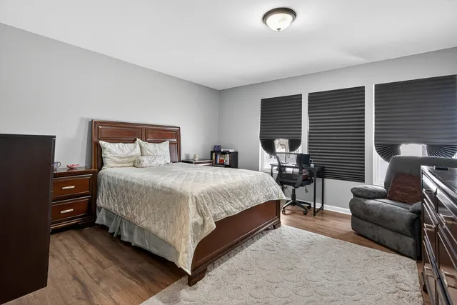 a bedroom with a bed and a couch