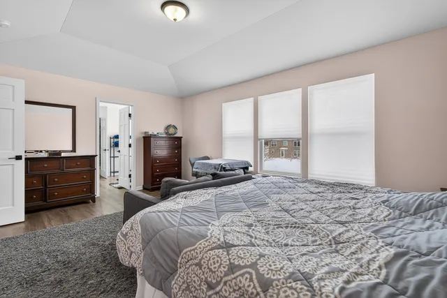 a bedroom with a bed and furniture