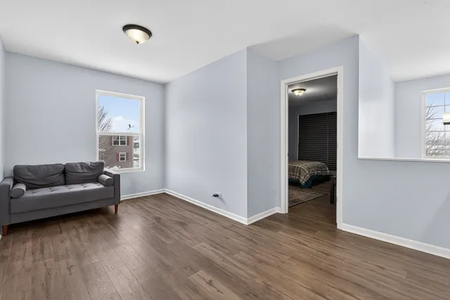 a view of a livingroom with furniture and wooden floor