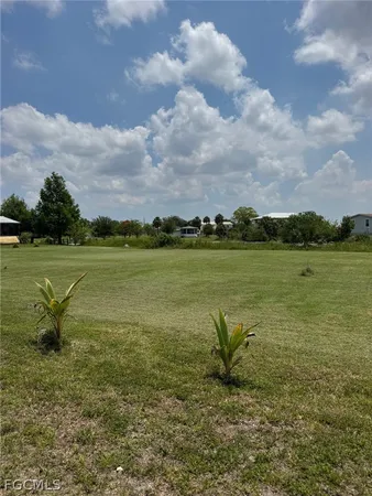 a view of a lake with a big yard