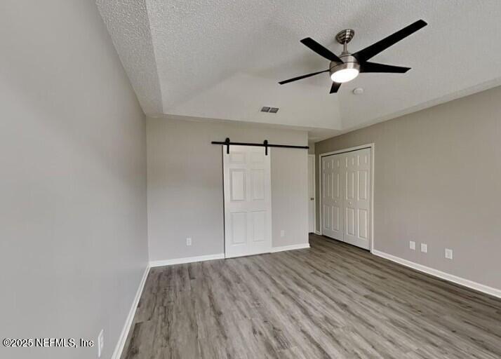 844 MacKenzie Circle St. Augustine, FL 32092 - Photo 9 of 20 an empty room with wooden floor and windows