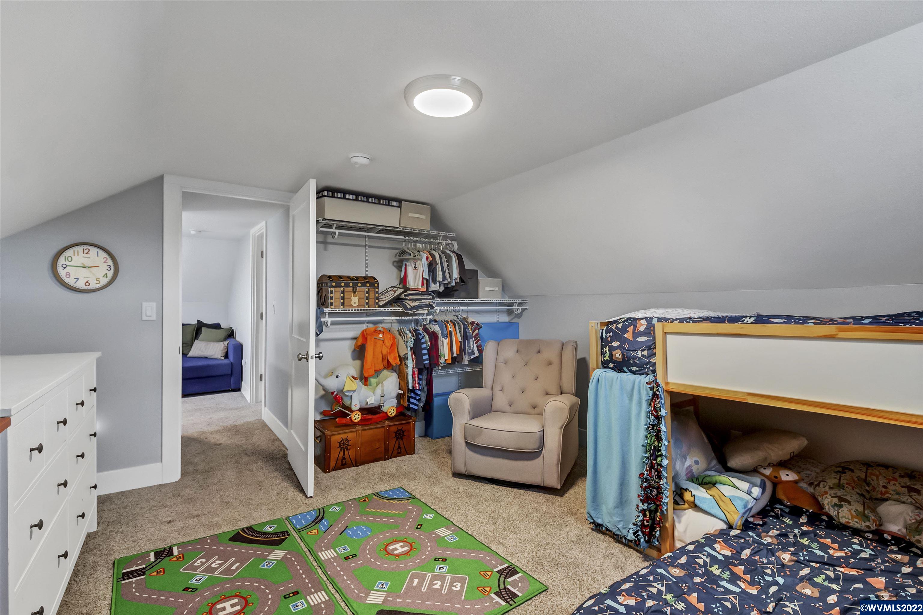 6067 Stayton Road Southeast Turner, OR 97392 - Photo 25 of 31 a living room with furniture and a baby crib