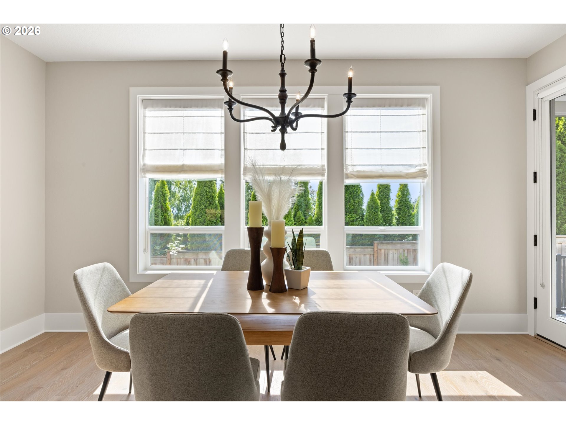 14551 Southwest 153rd Avenue Portland, OR 97224 - Photo 17 of 45 a dining room with furniture a chandelier and wooden floor