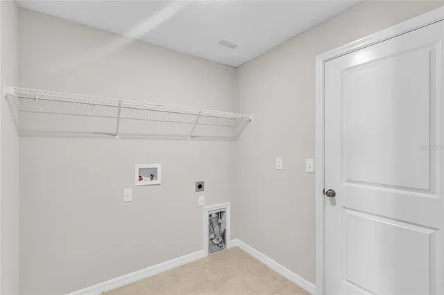 a kitchen with stainless steel appliances granite countertop a refrigerator and a stove