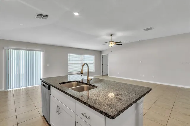 a view of kitchen cabinet and white cabinets