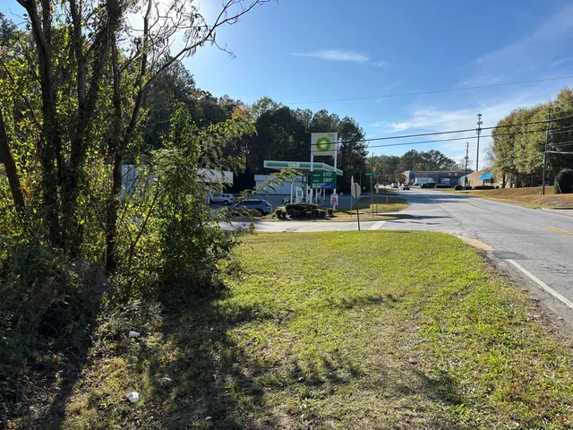a view of a swimming pool and trees in the background