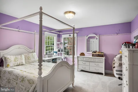 a bed room with a bed and a balcony