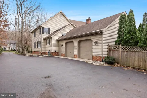 a large bedroom with a bed and furniture