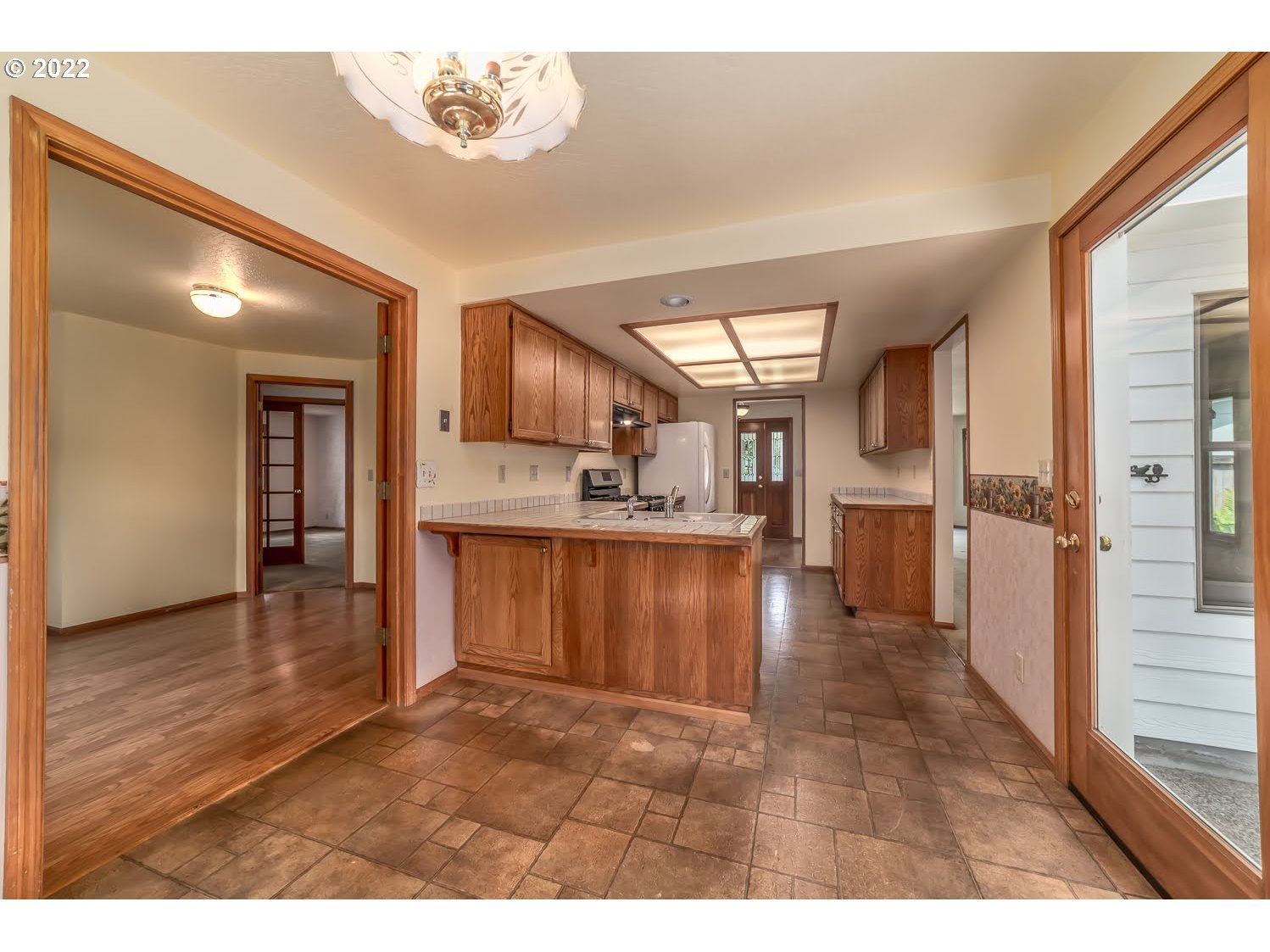 3166 W Street Springfield, OR 97477 - Photo 15 of 32 a view interior of kitchen and hall with wooden floor