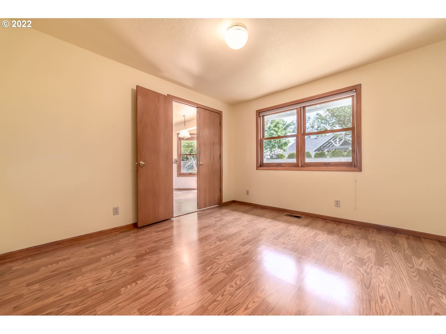 3166 W Street Springfield, OR 97477 - Photo 16 of 32 an empty room with wooden floor and windows
