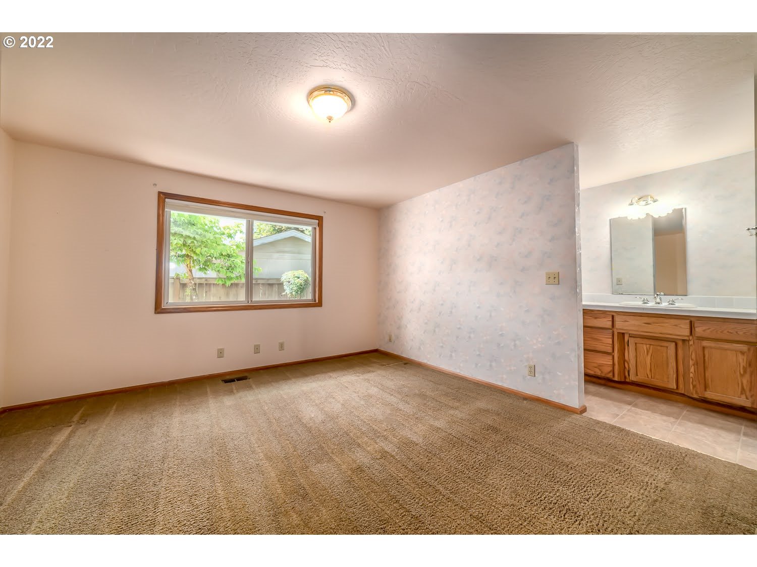 3166 W Street Springfield, OR 97477 - Photo 19 of 32 a view of an empty room with a window