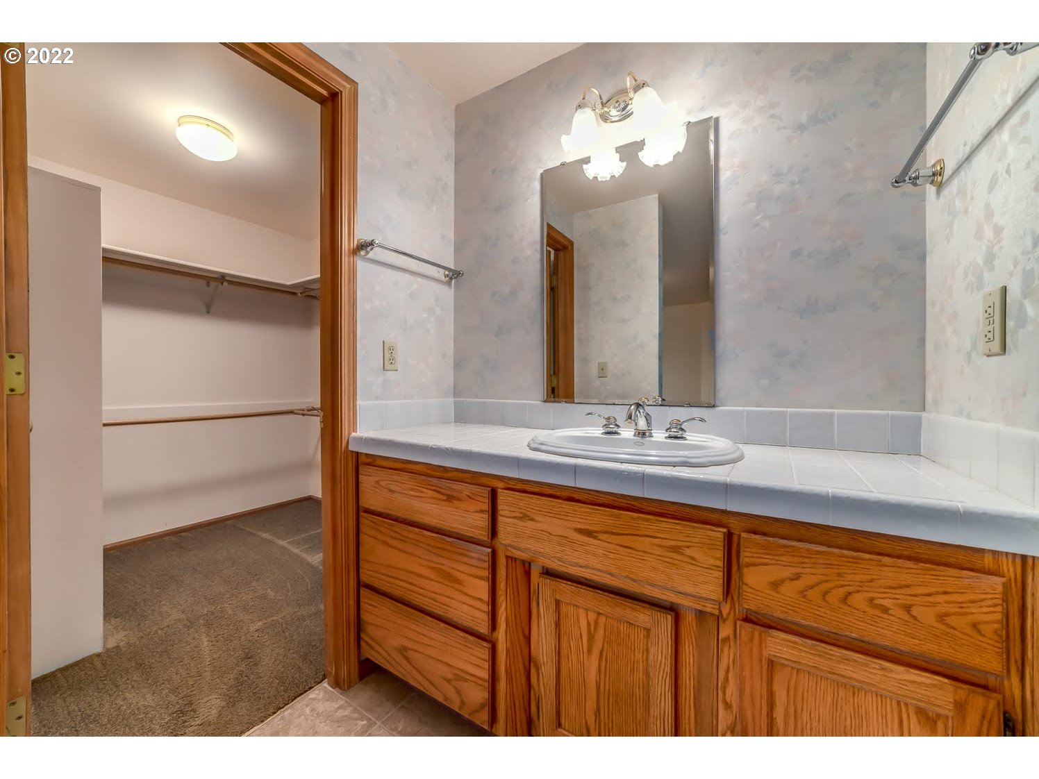 3166 W Street Springfield, OR 97477 - Photo 21 of 32 a bathroom with a sink and a mirror