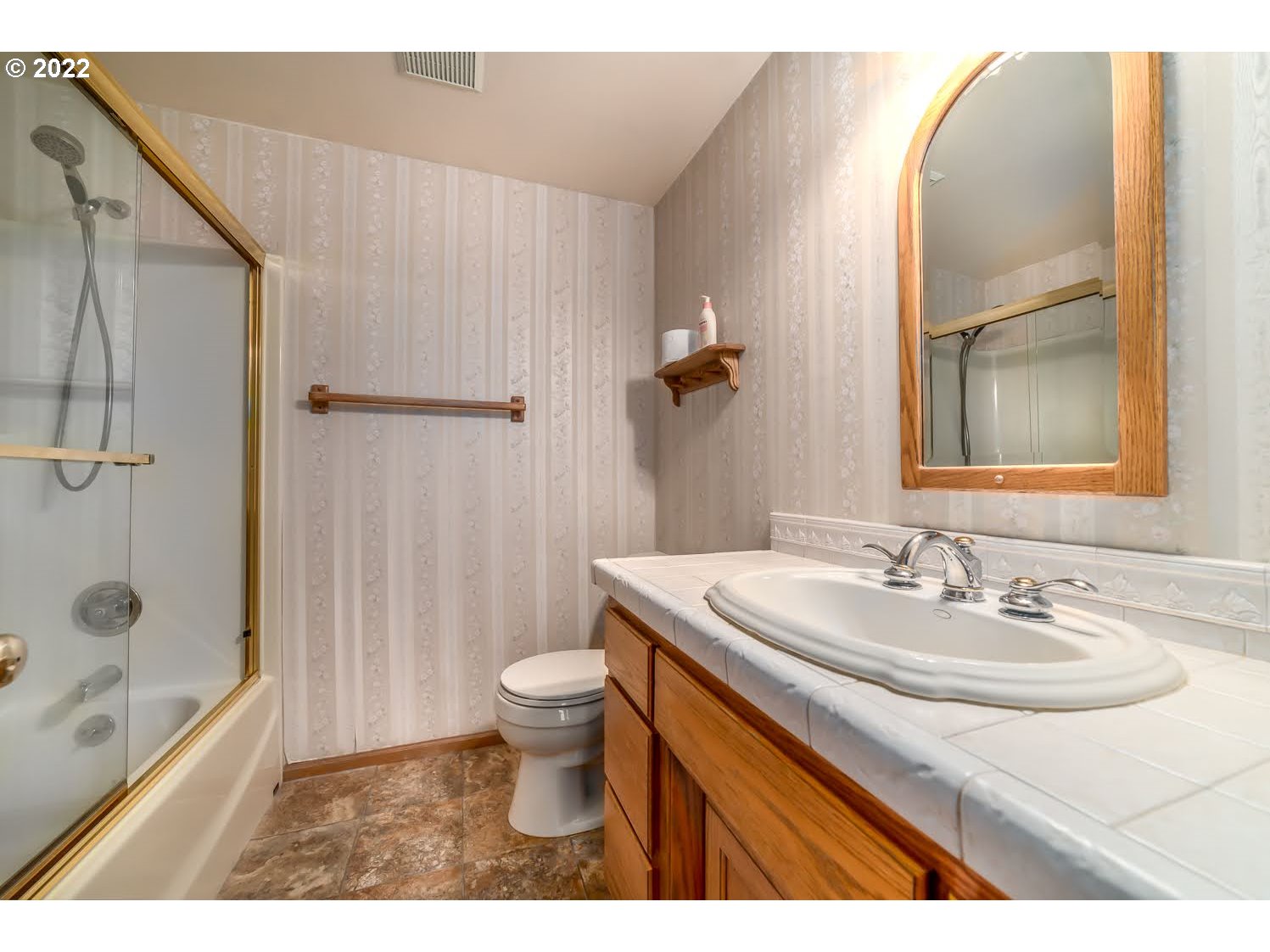 3166 W Street Springfield, OR 97477 - Photo 25 of 32 a bathroom with a sink a toilet and shower
