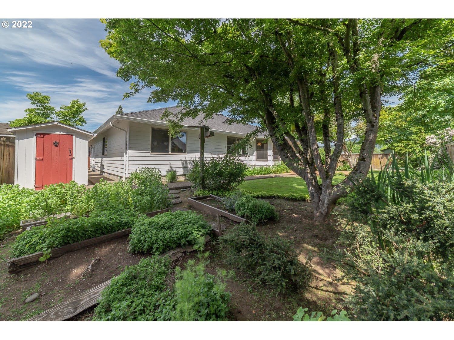 3166 W Street Springfield, OR 97477 - Photo 32 of 32 a front view of a house with a garden