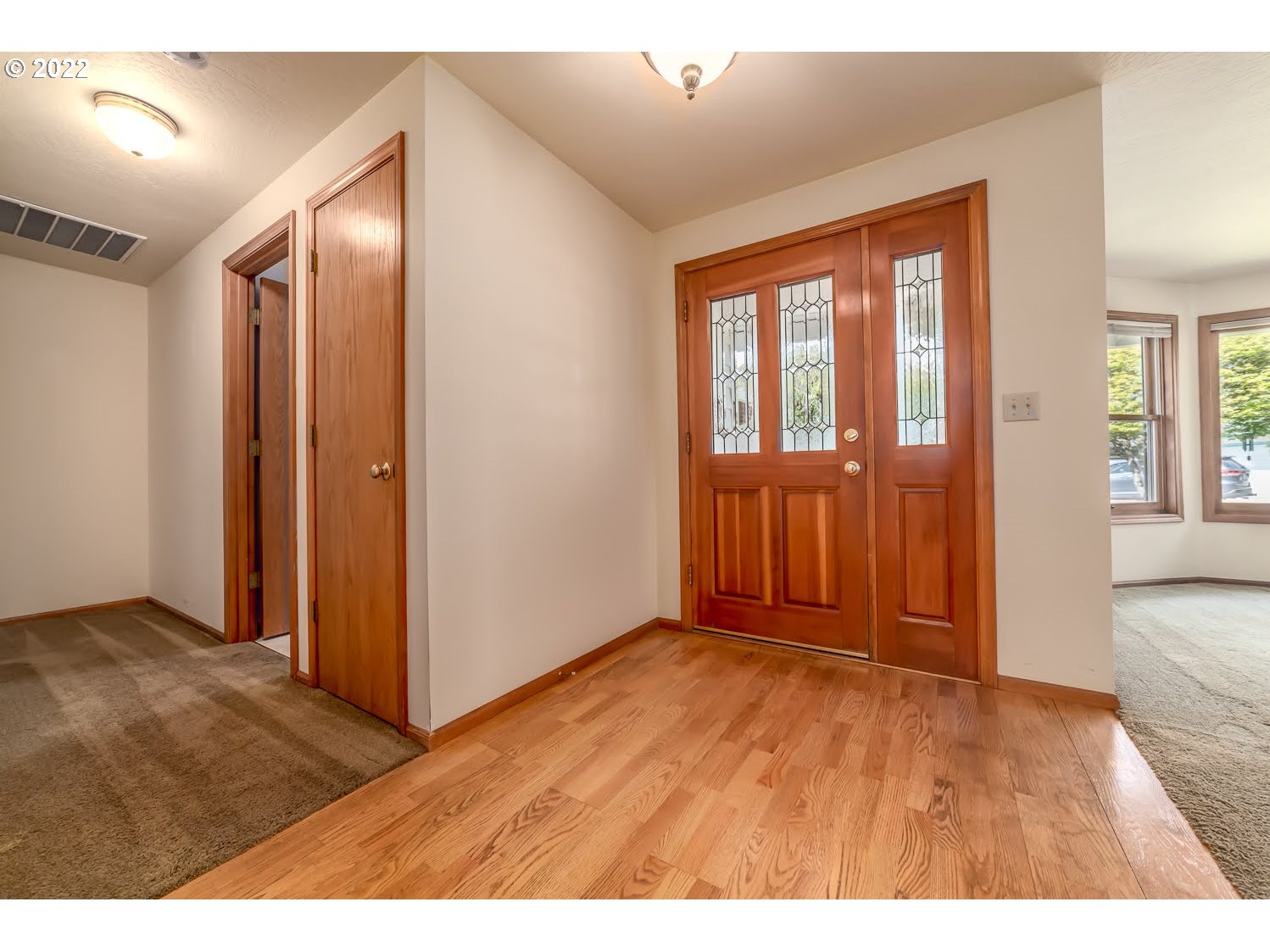 3166 W Street Springfield, OR 97477 - Photo 5 of 32 an empty room with wooden floor and windows