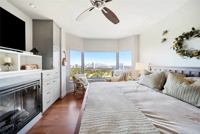 a large kitchen with kitchen island a large window a sink and stainless steel appliances