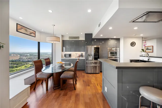 a view of a dining room with furniture and wooden floor