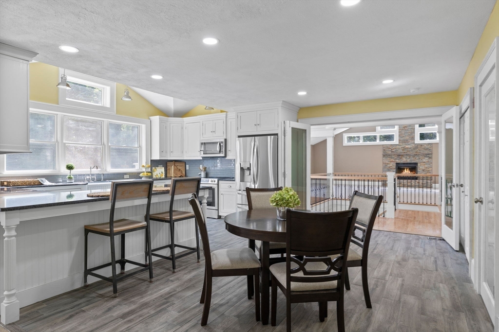 45 B Glendale Road Boxford, MA 01921 - Photo 10 of 38 a view of a dining room with furniture and wooden floor