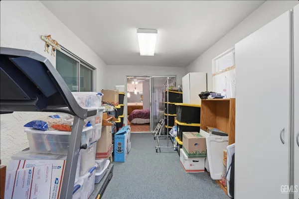 a view of a room with workspace and a window