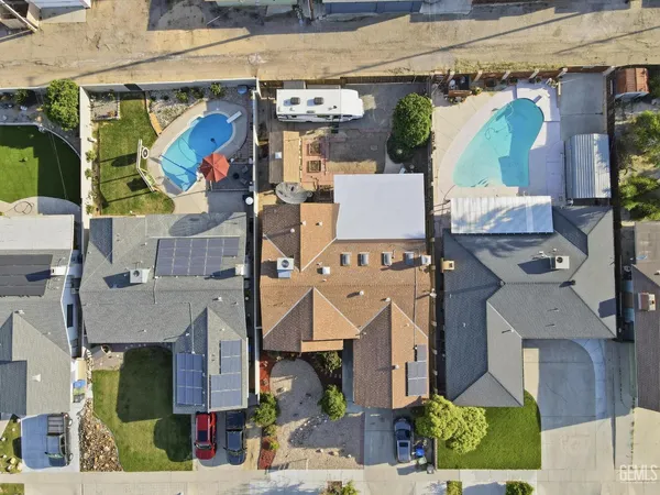 an aerial view of houses with outdoor space