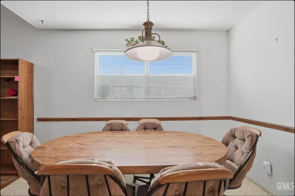 a bedroom with a bed and a table