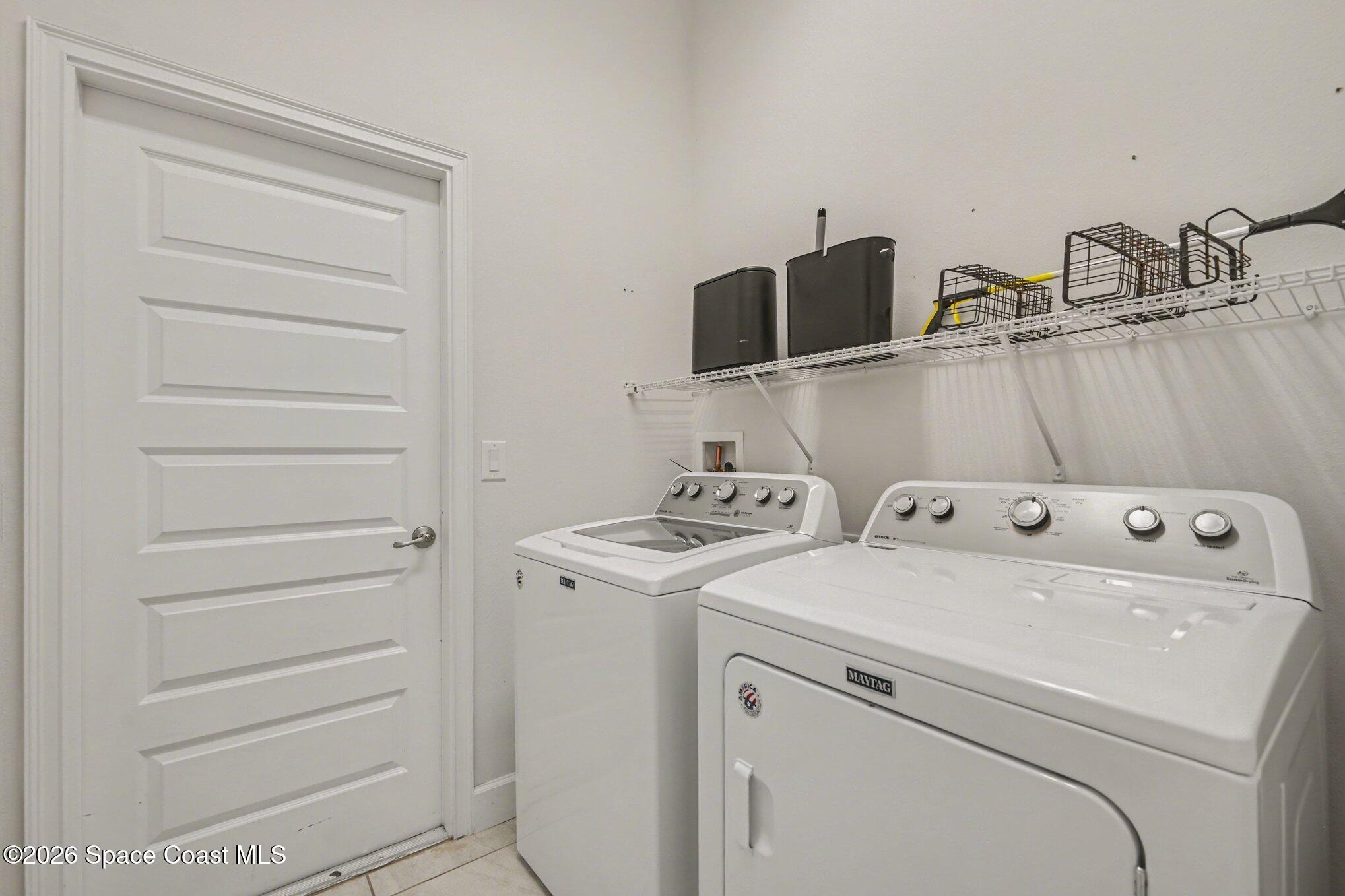 831 Tupelo Circle Cocoa, FL 32926 - Photo 20 of 23 a utility room with dryer and washer